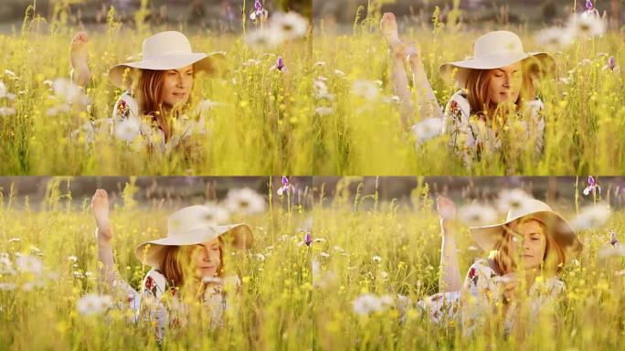 戴太阳帽的DS女人躺在草地上闻到野花的味道