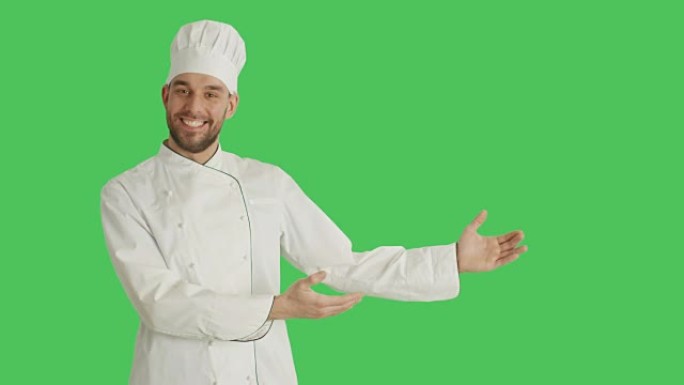 一位英俊的厨师做展示手势的中拍。背景是绿色屏幕。