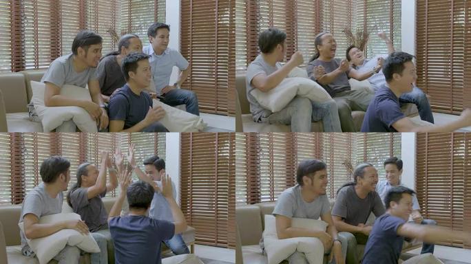 一群亚洲扁友在家电视观看体育比赛