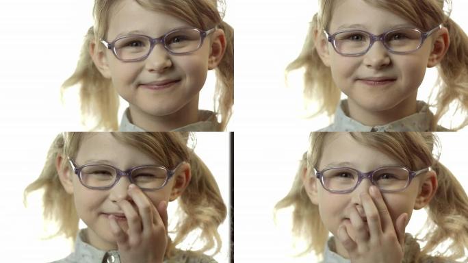 高清: 小女孩在鼻子上调节眼镜