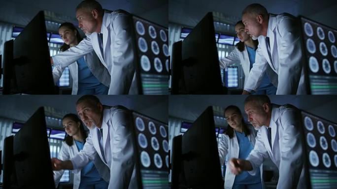 两位医学科学家/神经学家，在现代实验室的个人计算机上交谈和工作。研究科学家在神经生理学，科学，神经药