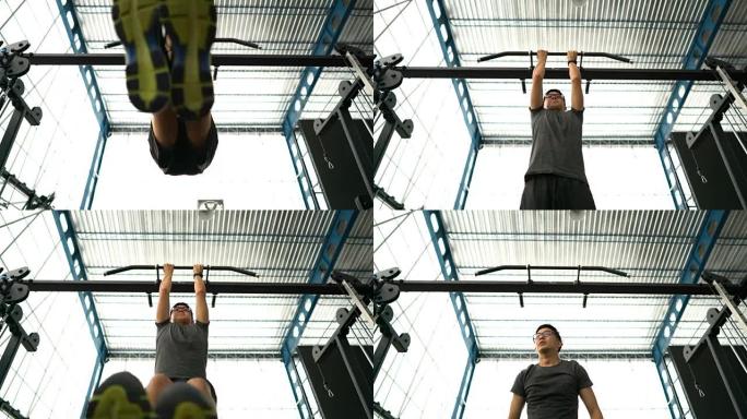 瘦亚洲男子做腹部肌肉锻炼锻炼