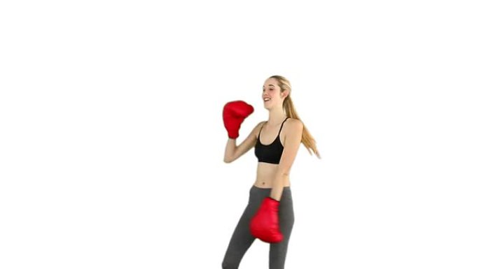 戴红色拳击手套的健身模特欢呼