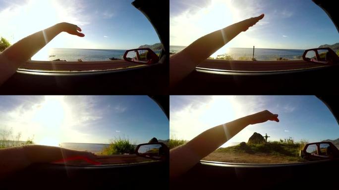 慢动作: 日落时沿着海滩行驶，手在夏风中挥舞