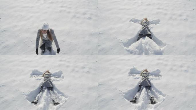 慢动作特写: 开朗的年轻女子制作雪天使