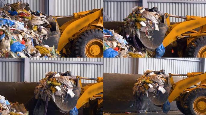 推土机，拖拉机在垃圾填埋场推一堆垃圾。