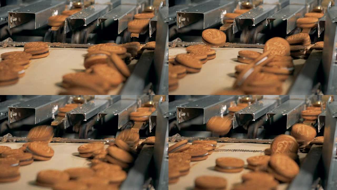 饼干从工厂的装配线上搬来。4K。