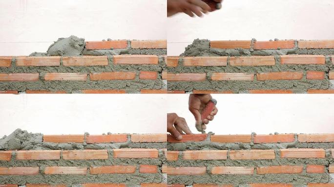 砌砖工人正在砌墙砌砖工人正在砌墙建筑工地