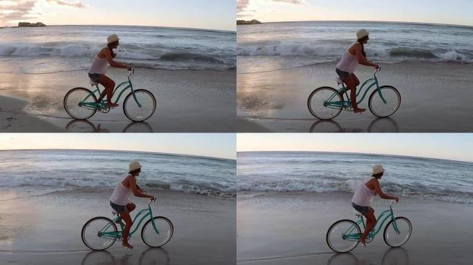 女人在海滩骑自行车