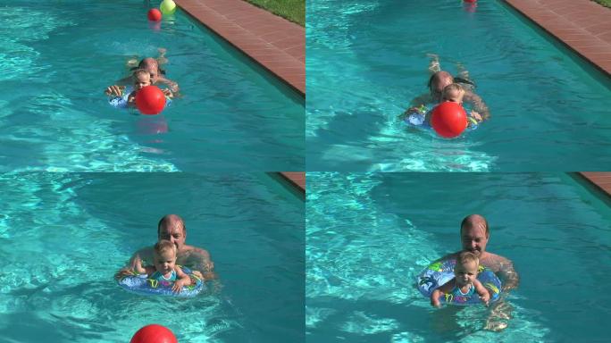 父亲和小女儿在游泳池里玩耍