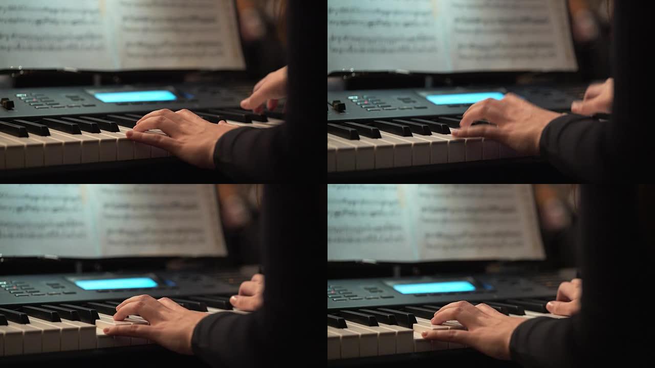 在音乐音乐会上，钢琴家的手扮演键盘手。键盘播放器