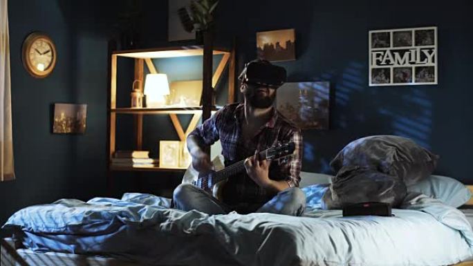 男子在VR护目镜中弹吉他