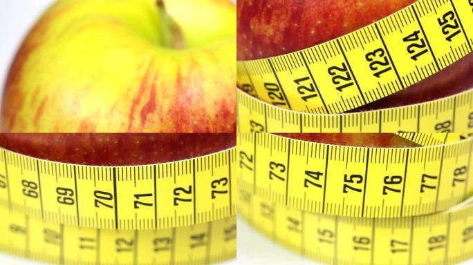 带卷尺的红苹果