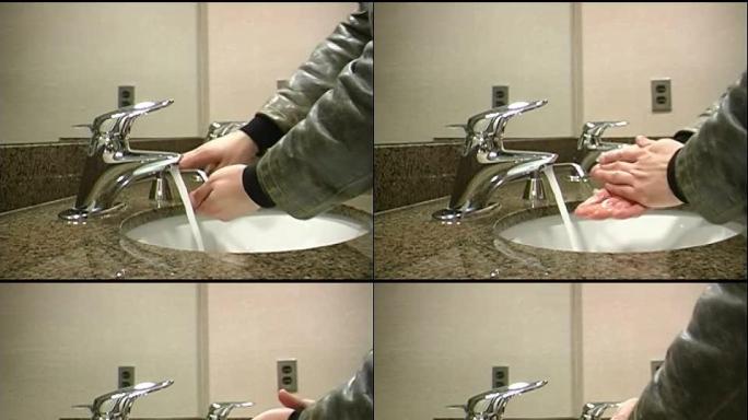 年轻人在公共厕所洗手