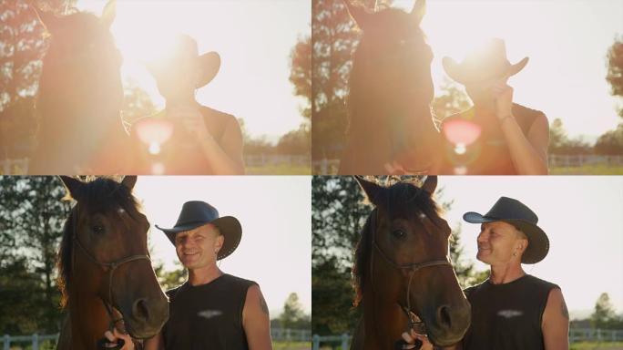 日落时戴牛仔帽和马的老人的慢动作剪影
