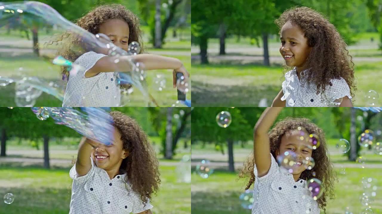 快乐的非洲女孩挥动魔杖制造泡泡