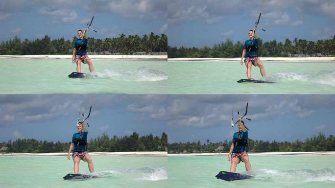 慢动作: 在风景如画的蓝色海洋中微笑的年轻冲浪女孩风筝冲浪