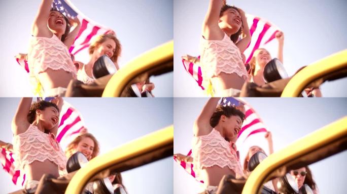 多种族的女孩快乐地悬挂着美国国旗