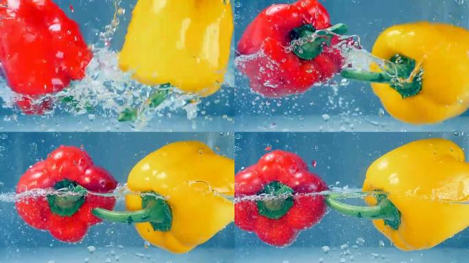 红色和黄色的辣椒掉入水中。