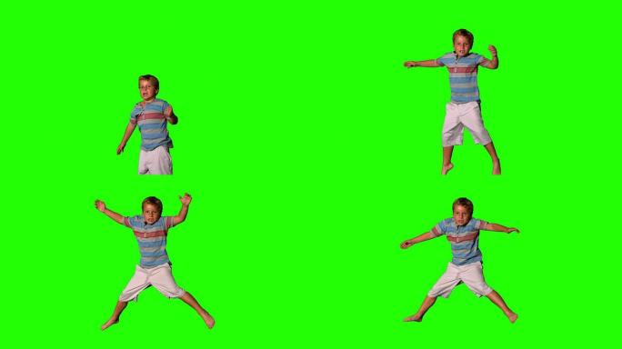 男孩在绿色屏幕上跳跃