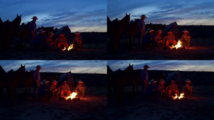在美国犹他州的篝火上，一群牛仔的手持视频