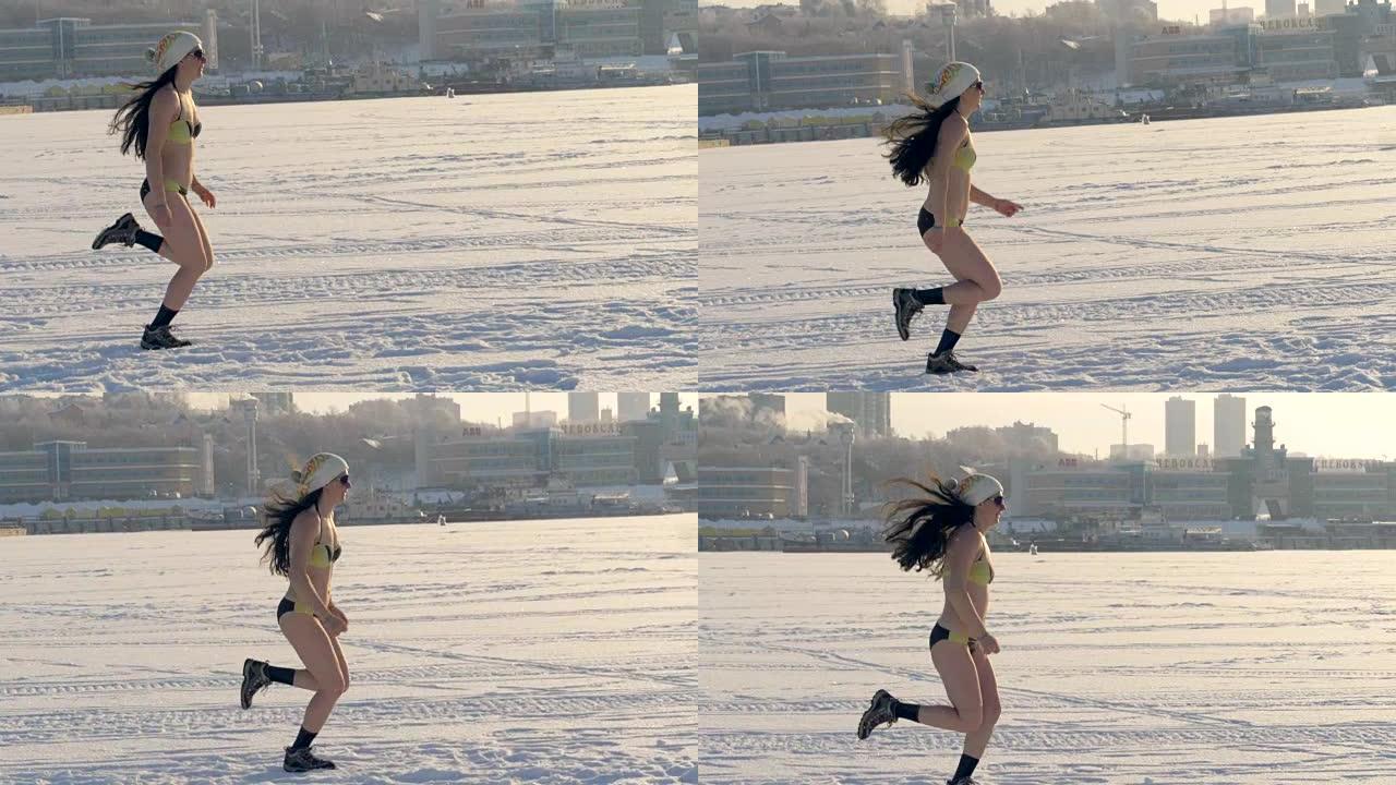 一个穿着比基尼的女人在结冰的河上奔跑。