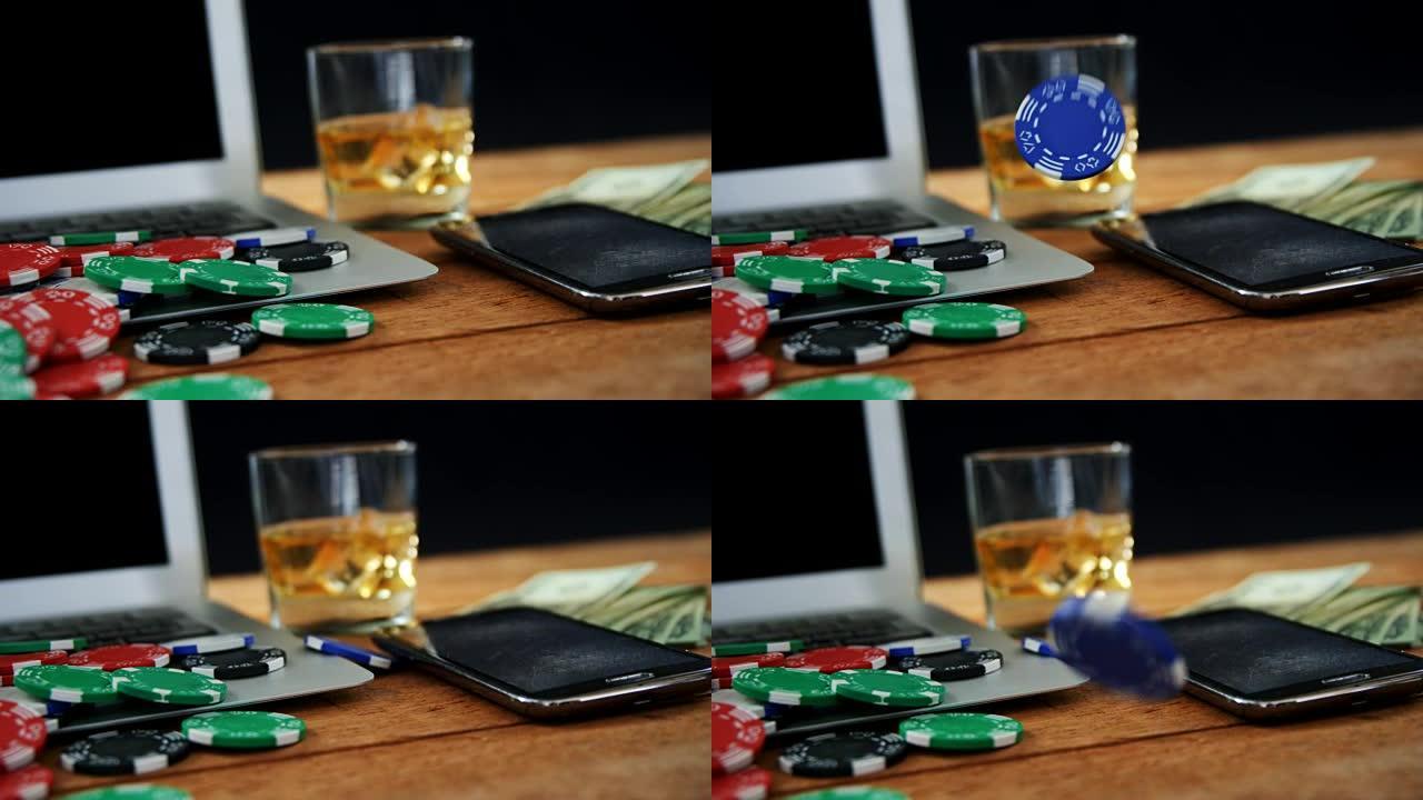笔记本电脑，赌场筹码，手机，货币和威士忌在扑克桌4k