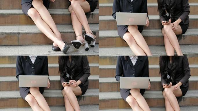 4K: 女商人在笔记本电脑上工作，以便在户外工作。