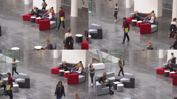 学生在繁忙的大学大厅里一起放松，拍摄于R3D