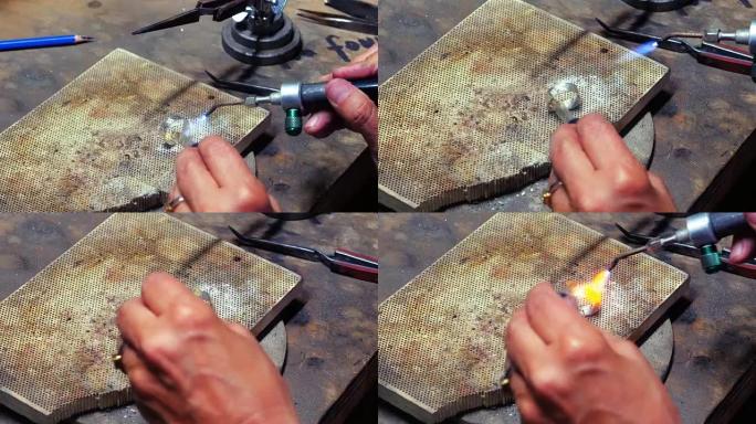 手工艺者用喷灯制作戒指