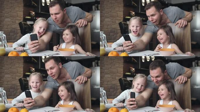 爸爸和小女儿为自拍照做鬼脸