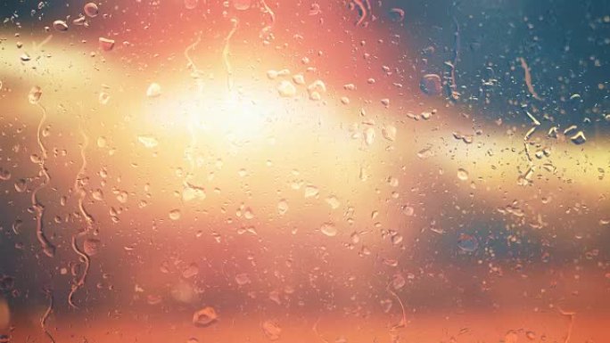 云层中的太阳在雨滴中透过玻璃发光