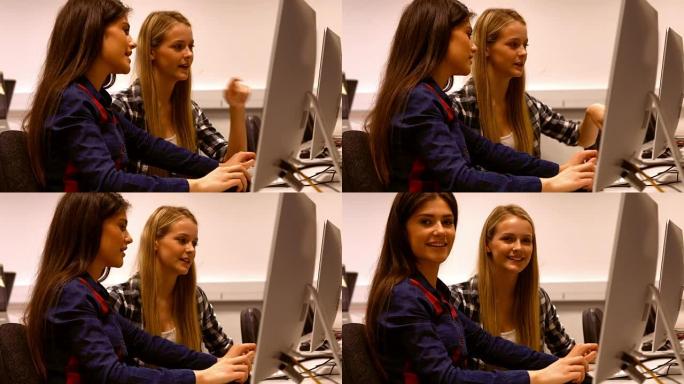 两名学生在电脑上工作