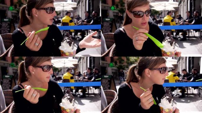 西班牙的年轻游客吃冰激丸