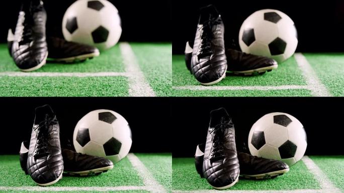 足球和防滑钉在人造草上的特写4k