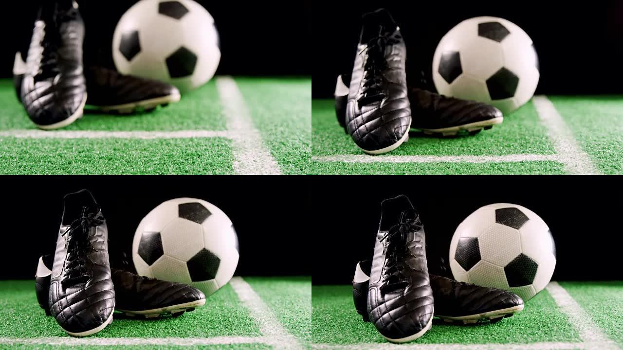 足球和防滑钉在人造草上的特写4k