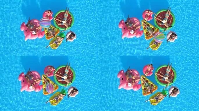 空中快乐的朋友在泳池水中玩有趣的充气漂浮物上打排球