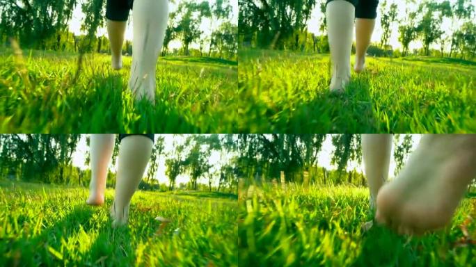 女人走过绿色的夏日草地