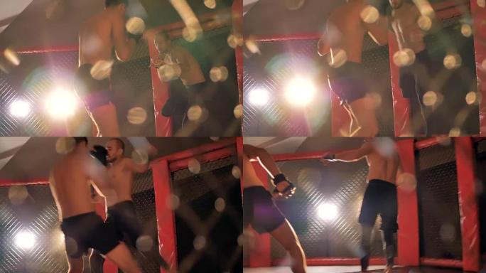 混合武术运动员在拳击场上慢动作战斗。4K。
