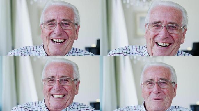 快乐的老人在家对着镜头笑，特写