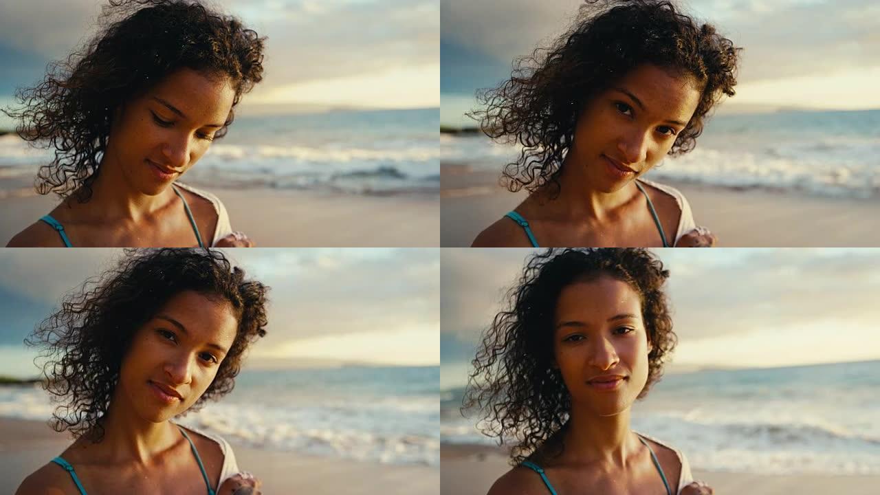 日落时海滩上美丽的年轻非洲裔美国妇女的肖像，柔和温暖的复古色调