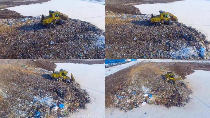 垃圾填埋场推土机在垃圾堆边缘移动。