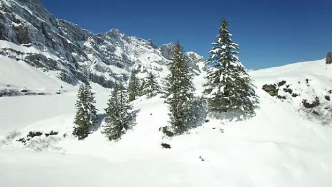 Aerial view of snow covered mountain range with be