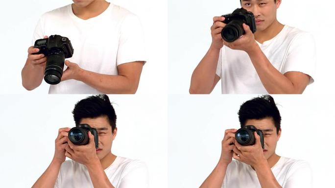 亚洲男子用专业相机拍照