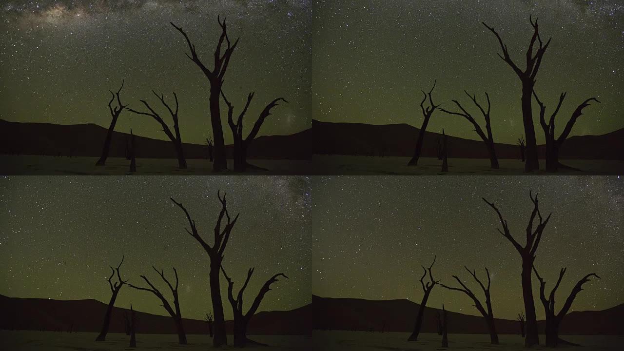 在Namib-Naukluft国家公园内的Sossusvlei，月亮落下和星星在天空中移动的4k时间