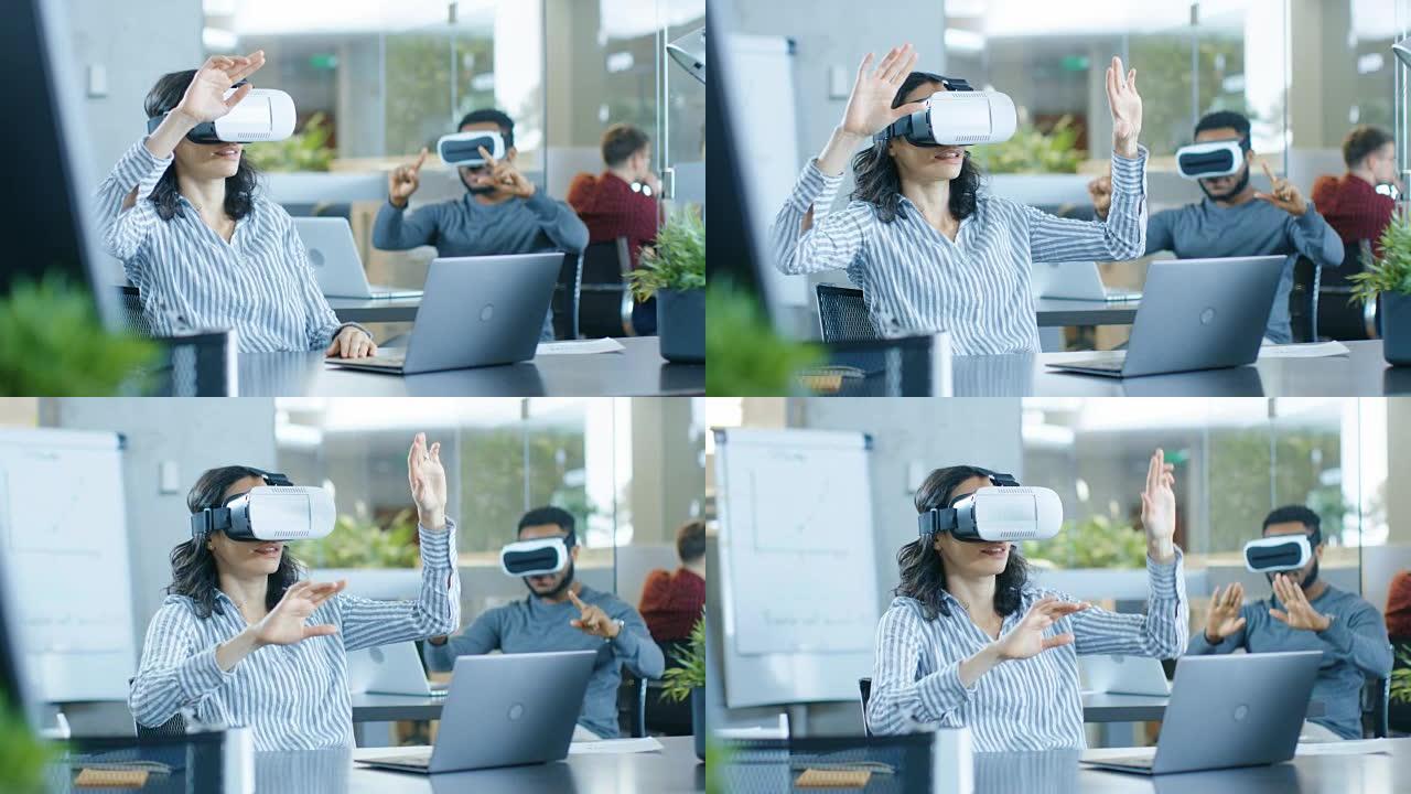 戴着虚拟Rreality耳机的女性虚拟现实工程师/开发人员与同事一起创建内容。聪明的年轻人从事增强和