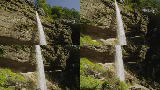 慢动作特写: 雄伟的大瀑布坠落在岩石上