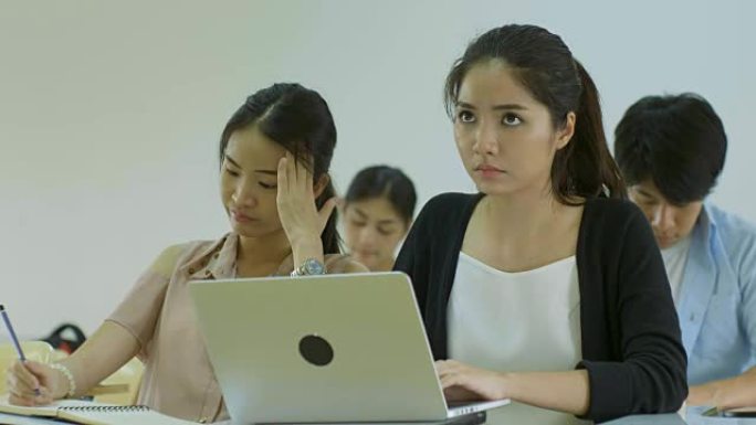 亚洲大学生在学习时看起来不快乐并感到压力