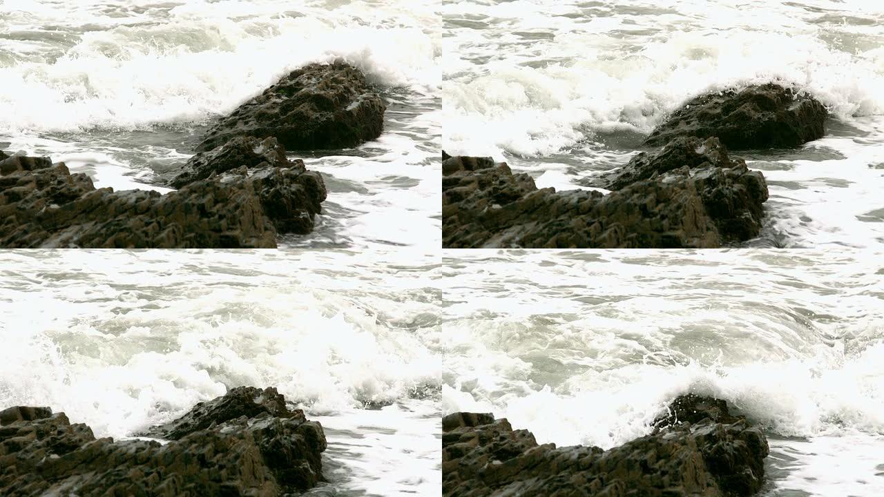 覆盖海岸岩石的波浪