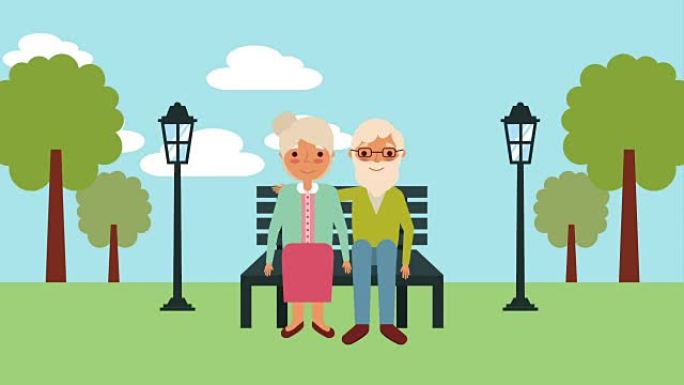 老年夫妇坐在公园的长凳上